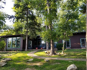 Flat yard and concrete walkway leading to Guntersville Getaway waterfront cabin on Lake Guntersville