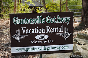 Guntersville Getaway vacation rental yard sign at 280 Morrow Drive in Guntersville Alabama
